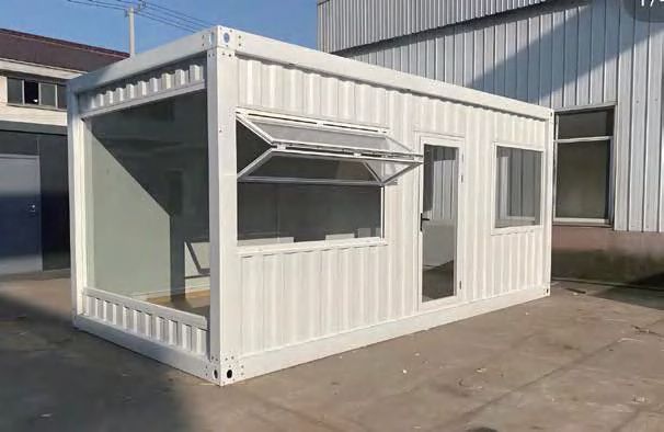 Folding container house unit with insulated panels and windows